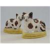 Image 1 : A PAIR OF SEATED CAT FIGURES, early 20th Century, brown and white, on oval plinths, height 11cm (...