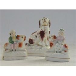 A STAFFORDSHIRE SEATED SPANIEL, 19th Century, gilt collar, brown and white coat, height 10cm, and...