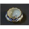 Image 1 : A SMALL FAIENCE POT, 20th Century, wavy rim, polychrome floral decoration, on three scrollwork fe...