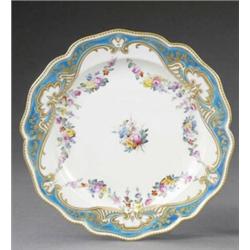 A Derby shaped edge plate, - A Derby shaped edge plate, painted to the centre, in the manner of...