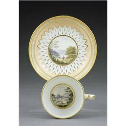 A Derby tea cup and saucer, - A Derby tea cup and saucer, pattern 118, painted, in the manner of...