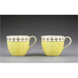 A pair of Derby fluted yellow ground tea cups, - A pair of Derby fluted yellow ground tea cups,...