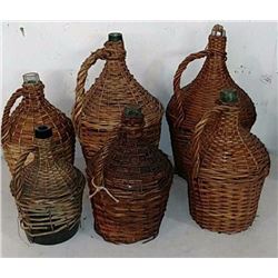 Antique glass jugs covered in wicker