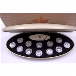 1999 Proof Millennium 12-coin Quarter set. (some capsules are lightly scratched)