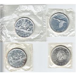 1962, 1964, 1965 and 1966 Canada Silver Dollars. 4pcs