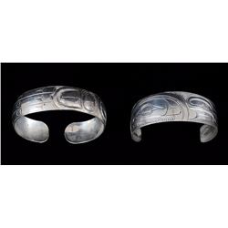 Two Northwest Coast Silver Bracelets; Incised Killer Whale Design Signed Illegibly  5" L. 3/4" W. Go
