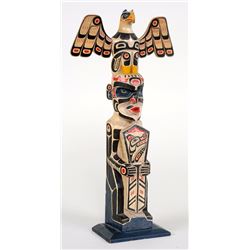 Totem Carved with Eagle and Tsonoqua Holding a Copper - Blunden Harbour, B.C. 11" H. 5 3/4" W.  Good