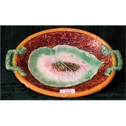 A 19th century majolica twin handled oval leaf pattern dish (af)....