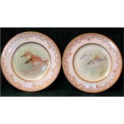 A pair of Royal Doulton cabinet plates painted with bream and sea...