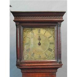 An antique oak longcase clock with square brass dial signed...