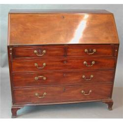 A good George III mahogany bureau with strung sloping fall...