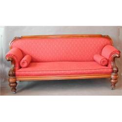 A fine Victorian upholstered sofa with substantial carved mahogany...