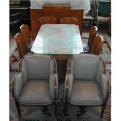 A pair of Art Deco leather upholstered cloud back armchairs....