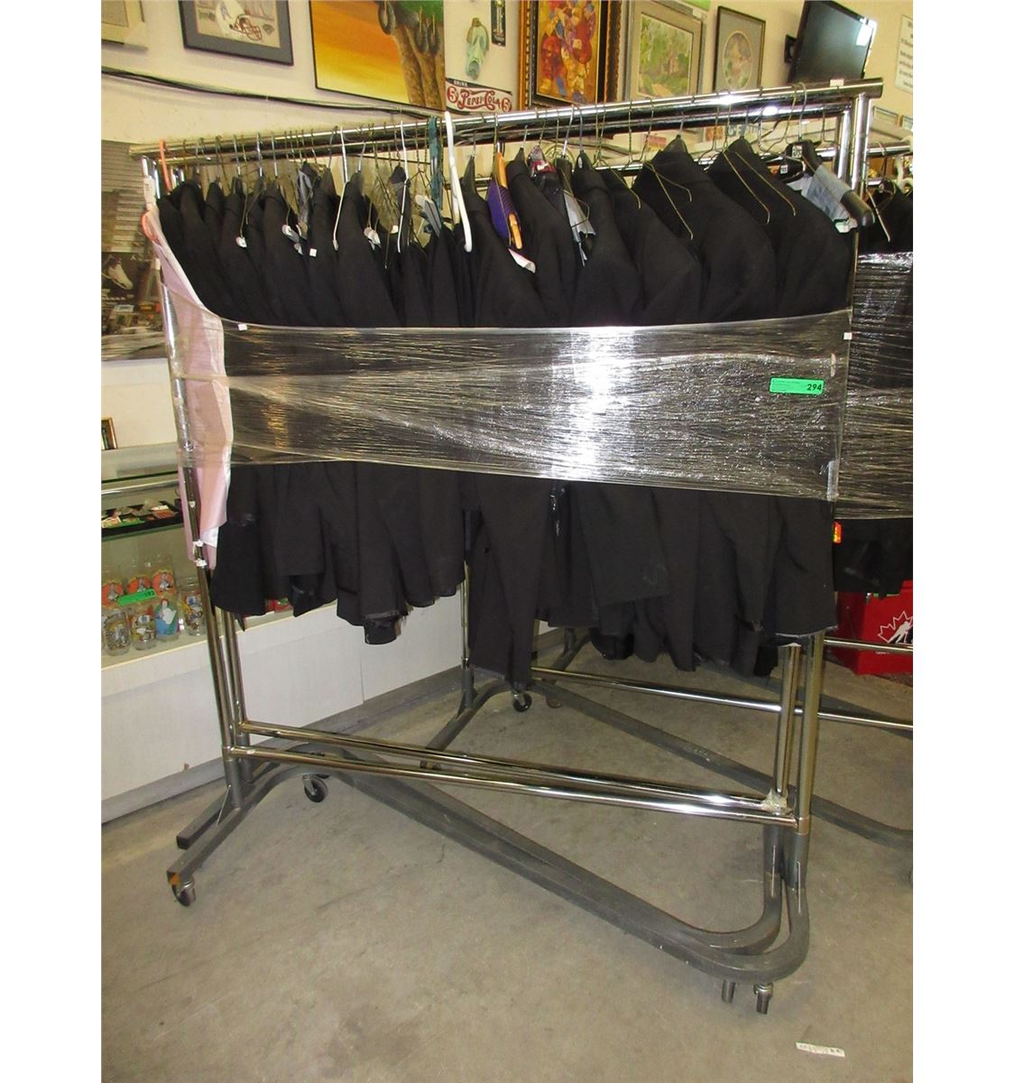 Rack of men's assorted tuxedos & suits