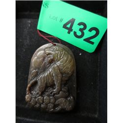 Carved stone pendant with tiger motif