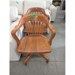 2 Vintage oak office chairs on casters