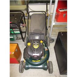 Used gas powered lawnmower with bag attachment