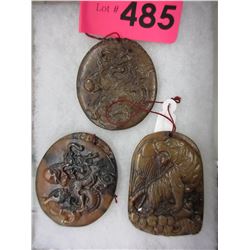 3 Carved stone pendants - Oriental motif