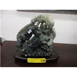 Carved stone statue with oriental motif