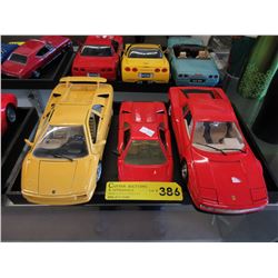 3 Die-cast scale model cars