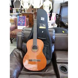 Used Yamaha acoustic guitar with soft case bag