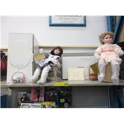 2 New bisque headed dolls with original boxes