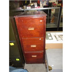 Used wood filing cabinet