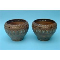A pair of Doulton Lambeth jardinieres, each stoneware body with marbled effect, the upper section...