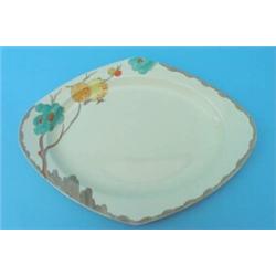 A Clarice Cliff Passion Fruit pattern Trieste shape platter, painted in colours, printed factory...