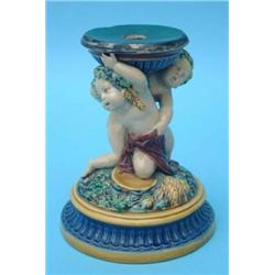 A Minton majolica comport stand, modelled as two bachanals, one with garlands of grapes, the othe...