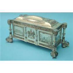 A Hamilton & Co, Calcutta, white metal casket, of rectangular shape, having domed lid, supported...