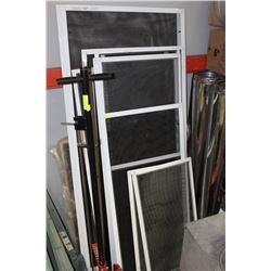 STACK OF WINDOW SCREENS