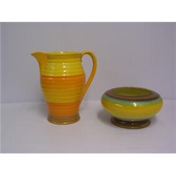 SHELLEY JUG decorated in yellow, orange and brown. Height 8 ins. Circa 1930's 30 - 50...
