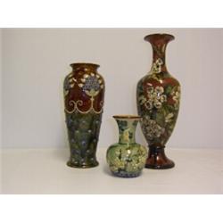 ROYAL DOULTON VASE with applied birds, butterfly and blossom on a green ground. Circa 1889 70 - 100.