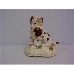 SMALL STAFFORDSHIRE DOG, brown and white with mossware flowers on base, A.F. on paintwork 40 - 60...