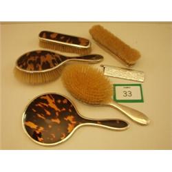 Silver and tortoiseshell dressing table set including brushes and mirror…