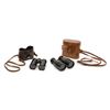 Image 1 : Two pair of vintage adjustable binoculars  including one with a leather car