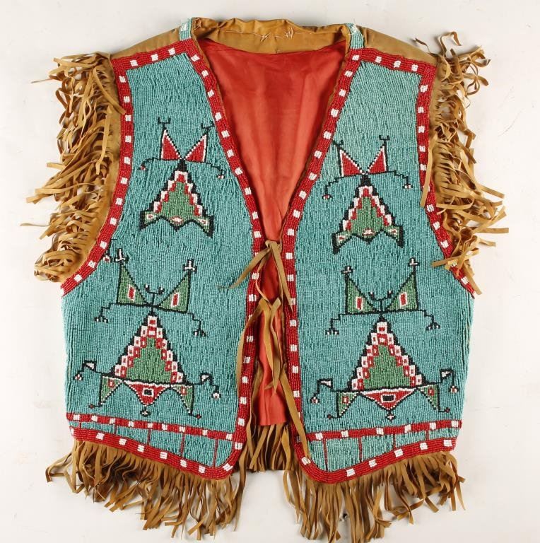 Indian Vest Examples Project Beaded Indian vest in traditional designs with fringed leather accents; si