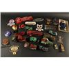 Image 1 : Plastic case of motor toys and badges; all  vintage.     Est.:  $300-$600.
