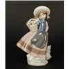 Image 1 : Lladro girl with flower basket, #5221; 7&#8221; in  height.     Est.:  $75-$150.