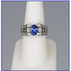 Image 1 : Elegant Blue Tanzanite and Diamond Ring  featuring an oval tanzanite weighi