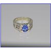 Image 2 : Elegant Blue Tanzanite and Diamond Ring  featuring an oval tanzanite weighi