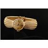 Image 1 : 14K yellow gold Ladies Geneve wrist watch in  good working condition. (weig