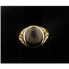 Image 1 : Men's ring set in 11.4 gr 14k gold with 12.0  carat Black Star Sapphire, si