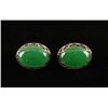Image 1 : One pair of oval jade(enhanced) earrings set  in 14 k yellow gold  Est:$500