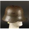 Image 1 : WWI helmet with studs for visor attachment.  Shot full of holes by large bu