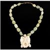 Image 1 : Carved ivory orchid with accenting jadeite  necklace. Est.: $300-$600