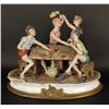 Image 1 : Capodimonte porcelain multi-figural of boys  playing cards; signed by artis