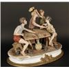 Image 2 : Capodimonte porcelain multi-figural of boys  playing cards; signed by artis