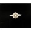 Image 1 : One classic ladies diamond ring in platinum  set with a round brilliant cen